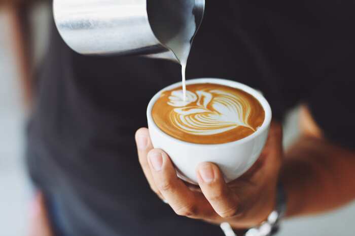 barista shows how to make latte art